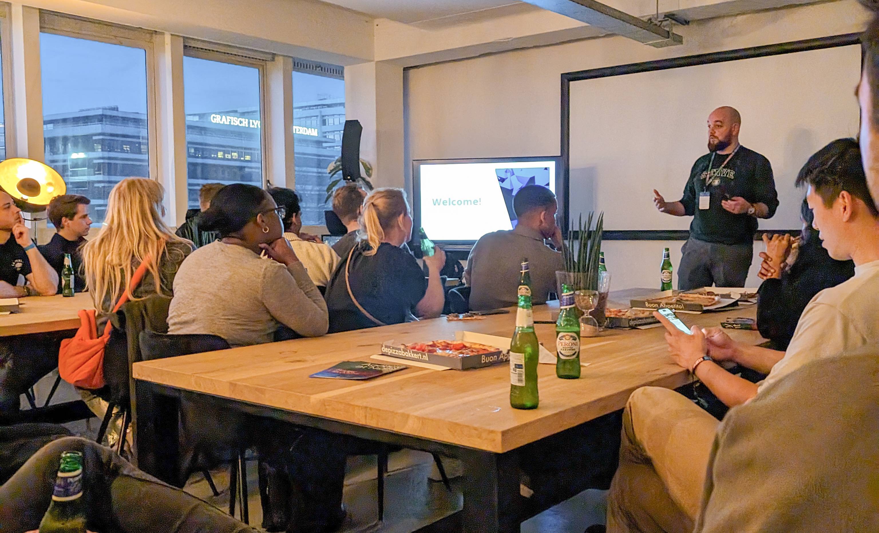 Jan presenting during Agency at Night 2024